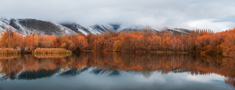 Dramatic Autumn reflections panorama