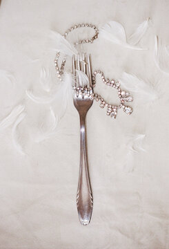 Fork decorated with feathers and gemstones 