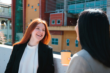 Young professional women talking during a break