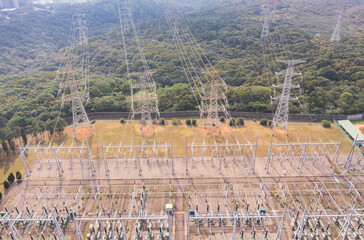 Aerial View of High-Voltage Substation Surrounded by Nature