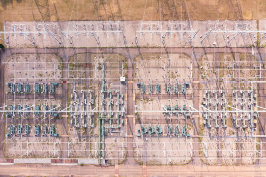 Aerial view of a high-voltage power substation grid