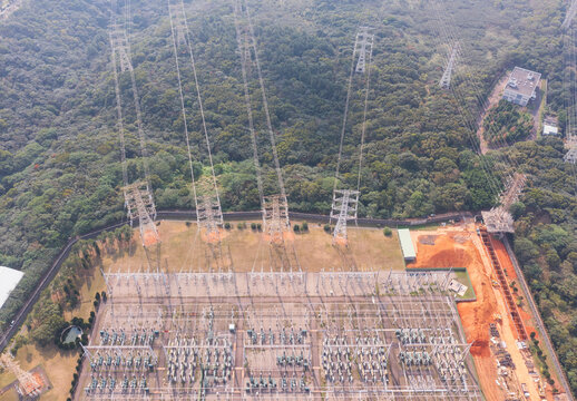 High-Voltage Substation Aerial View Forested Hillside