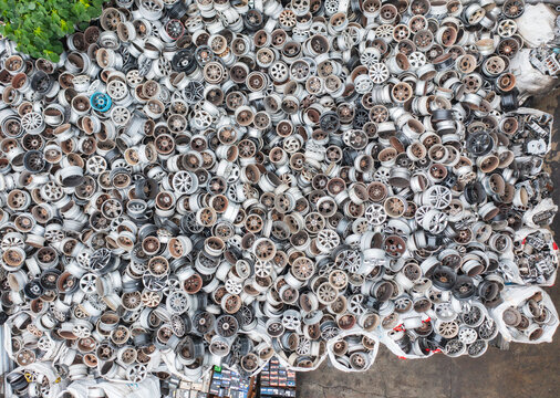 Mountain of Discarded Car Rims at Recycling Facility