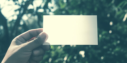 Obraz premium Minimal Blank Paper Mockup in Hand