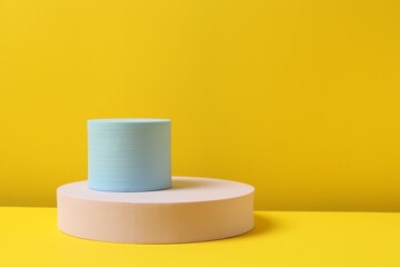 Podiums on a yellow background