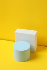 Podiums on a yellow background