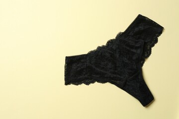 Flat lay with women romantic underwear on beige background, top view