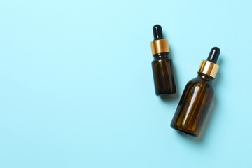 Natural cosmetic products a blue background, top view