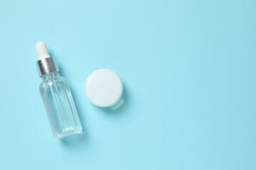 Natural cosmetic products a blue background, top view