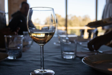 Elegant glass of white wine on a dining table