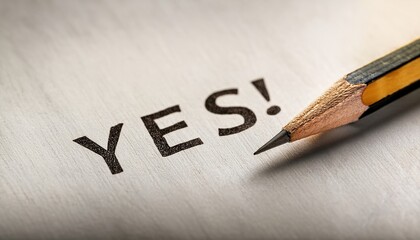 Yes written in bold text with a sharpened pencil on wooden surface