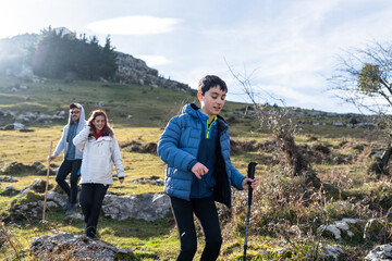 Family hiking in the mountains of Spain enjoying a sunny day