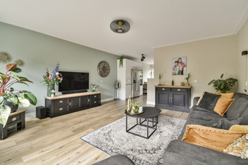 A stylish modern living room featuring contemporary furniture, a cozy atmosphere, and elegant decor elements, perfect for relaxation and socializing.