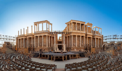 Fototapeta premium View of people setting up the stage of the Roman Amphitheater of Merida.
