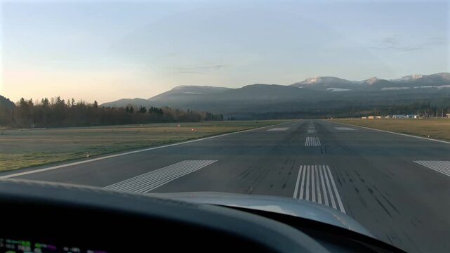 Propeller Airplane Lands at the Runway Markings - Pilot POV