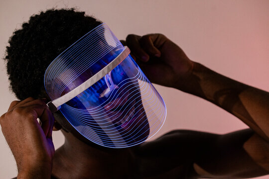Man in LED Face Shield with Neon Glow