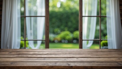 Empty wooden tabletop in the foreground with a blurred white curtain window above and a vibrant green garden background for product display template.