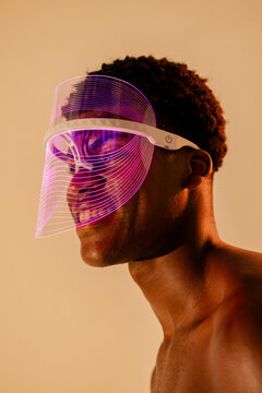 Smiling Man in Illuminated LED Face Shield