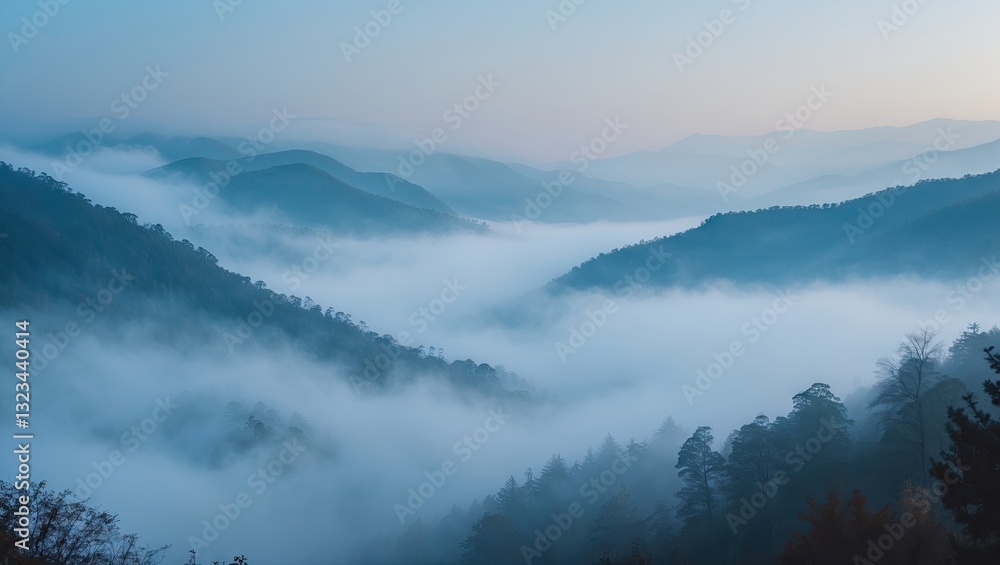 Aufkleber serene fog-covered blue mountains at dawn with misty valleys and soft light illuminating layered pea