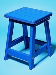 Blue wooden stool on light blue background. Simple design, small size, suitable for indoor or outdoor use. Clean lines, smooth surface.