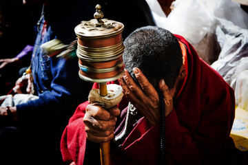 A Buddhist devotee praying wholeheartedly with deep faith and devotion, expressing spiritual...