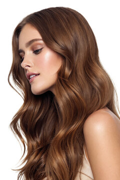 A portrait of a woman with long, flowing brown hair, showcasing a side profile against a black background.