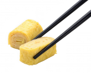 A close-up of sliced omelette rolls being held by chopsticks, showcasing a vibrant yellow color and a soft texture.