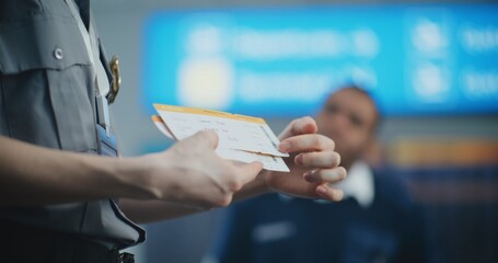 Airport Staff Briefing: Close Up of Security Officer Holding Boarding Pass, Providing Instruction,...