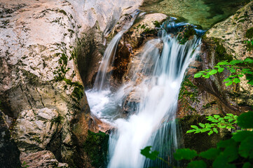Immersion in the greenery. Kobarid natural waterfalls of Kozjak. Wonder of nature