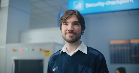 Airport Security Checkpoint: Portrait of Male Security Officer in Uniform Smiling, Looking at...
