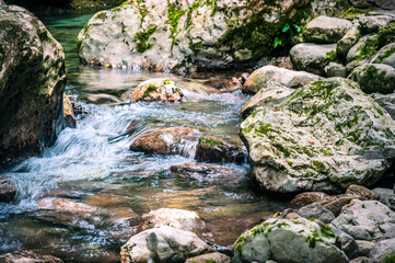 Immersion in the greenery. Kobarid natural waterfalls of Kozjak. Wonder of nature