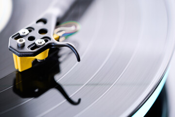 Turntable stylus on a spinning vinyl record during playback