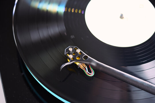 Close-up view of a turntable with a spinning vinyl record