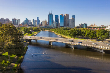 Bust brdge over inner city river and high rise buildings