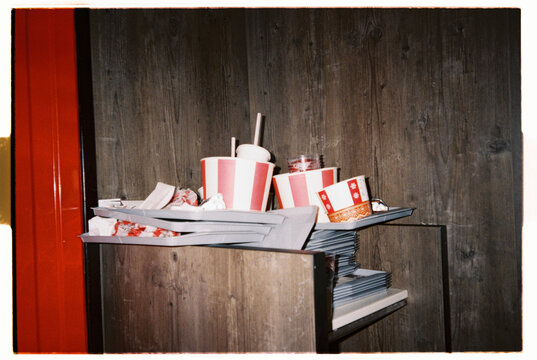 Fast food leftovers pile up in a restaurant corner during busy day