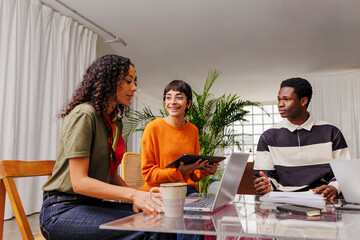 Diverse team collaborating in modern office setting
