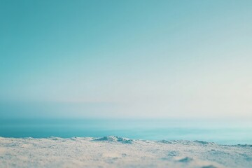 Fototapeta premium Serene snow landscape with a clear, pastel sky.