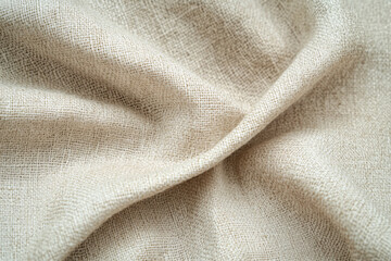 Soft and warm beige fabric texture background in neutral color providing a cozy and inviting design element for interiors