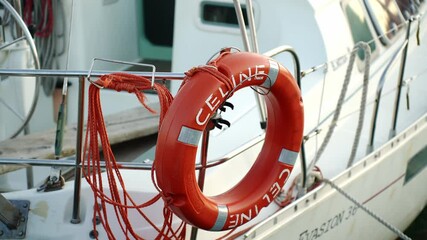 Ring life boy on big boat.Obligatory ship equipment.Personal flotation device.Prevent drowning.Orange lifesaver on the deck of a cruise ship.Traveling to an island.