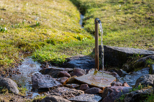 Artesian well. Eruption of spring, natural environment. The artesian well in Kärdla. We owe their crystal-clear water, to the meteorite impact that occurred about 455 million years ago. 