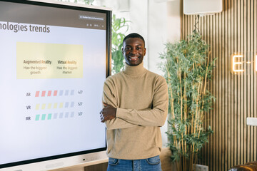 Professional standing by presentation on technology trends