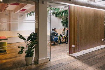 Modern office meeting space with vibrant decor and plants