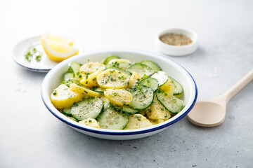 Homemade potato salad with cucumber and lemon