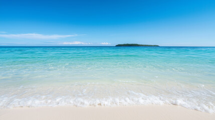 Fototapeta premium tranquil beach with gentle waves and distant island under clear blue sky