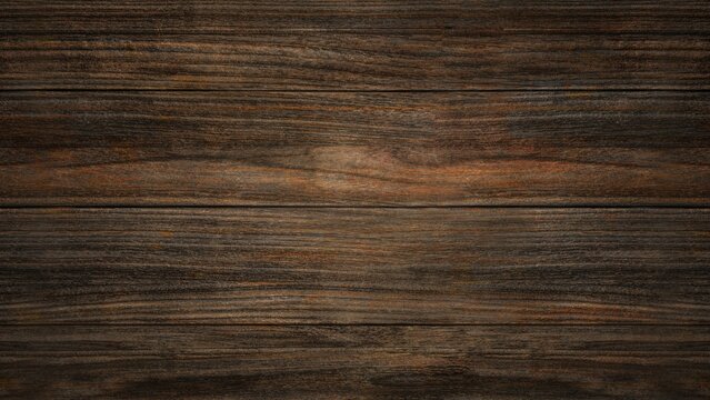 A dark wooden plank texture with a deep brown hue, featuring a subtle glow in certain areas, creating a moody and rustic atmosphere.