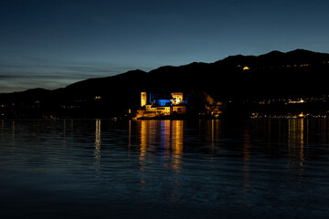 San Giulio Island at night 
San Giulio Island illuminated, at night with the moon. in Lake Orta. Italy, Piedmont.