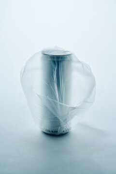  Metal Can Wrapped in Transparent Plastic Bag