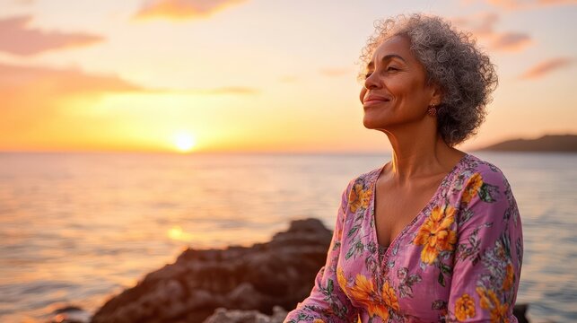 Woman contemplates serene ocean sunset scene