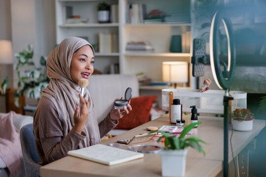 Woman recording makeup tutorial