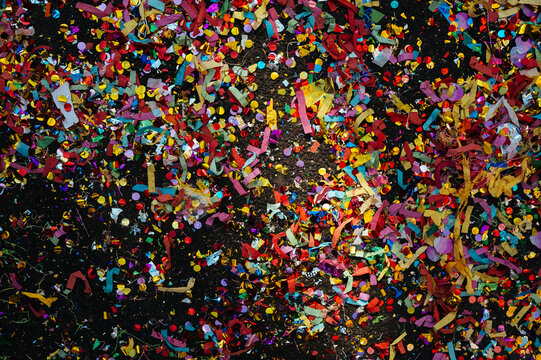 Multicolored confetti scattered on the ground